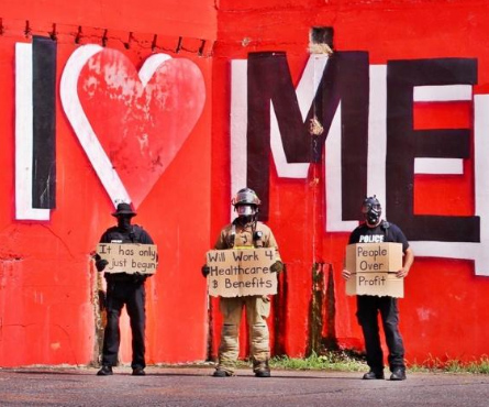 i-love-memphis-police-and-firefighters-in-front-of-mural